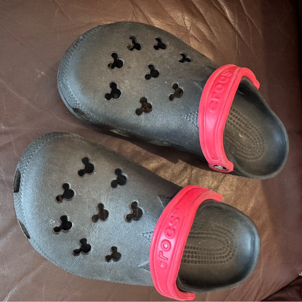 CROCS Disney unisex’s Black Clogs with Red Heel Strap